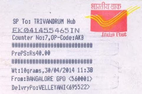 Real India Post Speed Post receipt showing the 13-character consignment number EK041455465IN printed on the second line below the destination hub